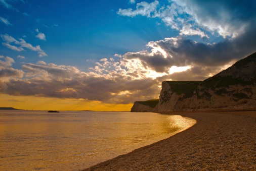 White cliffs of the Dorset coast at sunset.