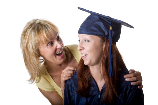Mother and daughter after graduation. Isolated on white. Horizontal.