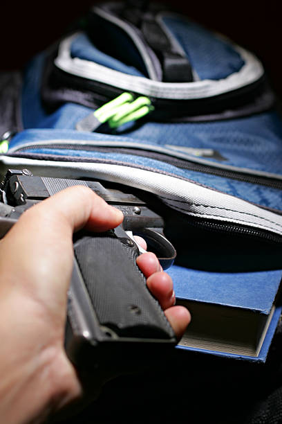 Book bag and a handgun stock photo