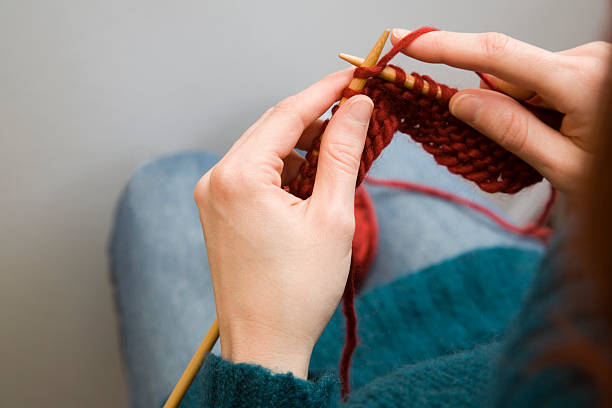 Woman Knitting 2 woman knitting, shot with a Canon 5D knitting needle photos stock pictures, royalty-free photos & images