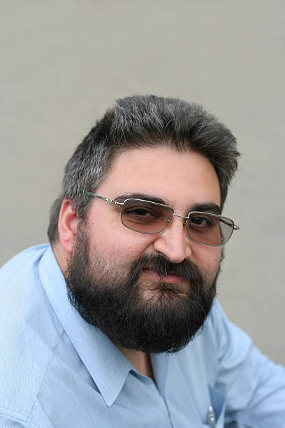 istock tired beardy businessman 172226944