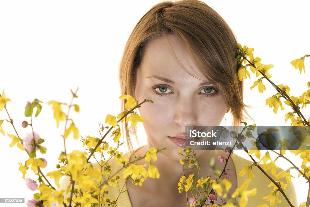 Girl and spring flowers Young woman among yellow flowers 20-24 Years Stock Photo