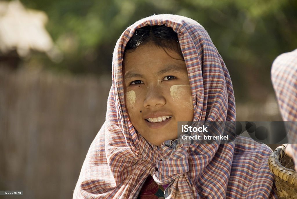 Three girls on ox cart "3 Myanmar girls - from Bagan - on an ox cart.The makeup is 'traditional' to protect against sun, made from 'tanaka', a tree" Agriculture Stock Photo