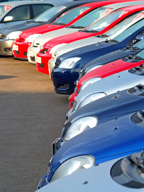 many cars parked in a row.