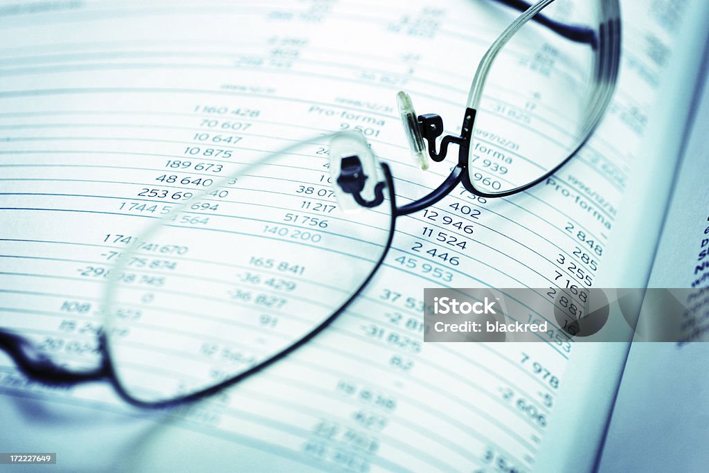 Profit Closeup of eye glasses on financial report.Similar images - Bank Statement Stock Photo