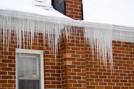 Icicles on a roofline with serious ice damming.