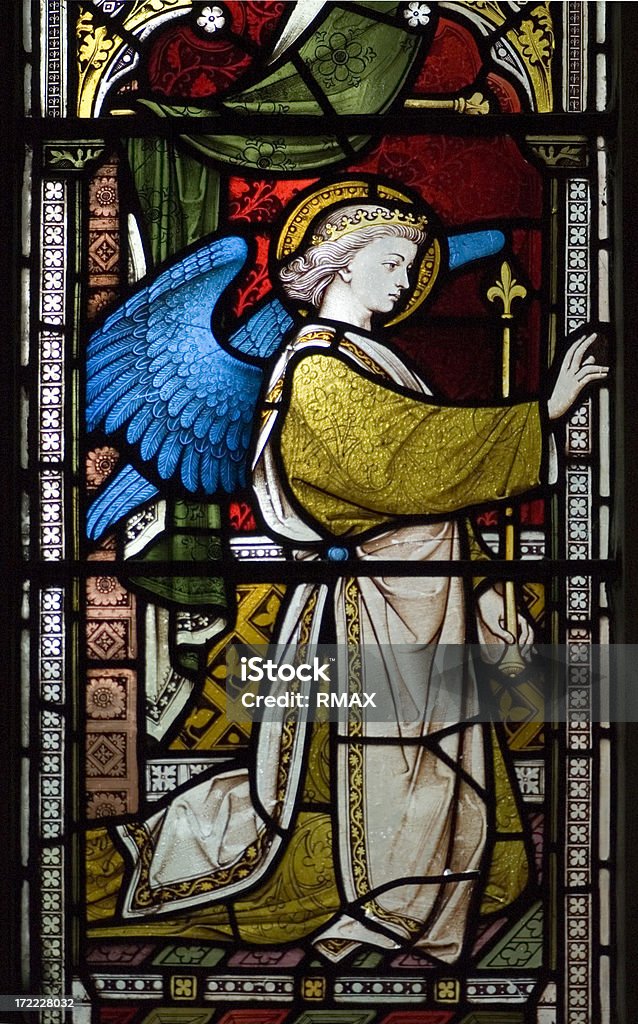 Ancient English Church Stained Glass "This is a detail from a very old stained glass window in a All Saints church (Surrey, England). The Church is hundreds of years old." Angel Stock Photo