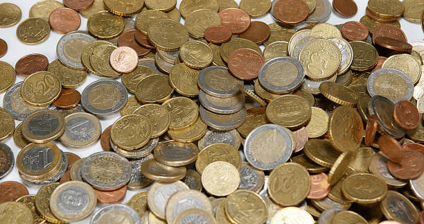 istock Euro Coins Falling against white Background 1722281380