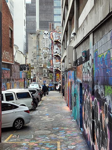 People walking in Bidencopes Lane, Hobart’s street art hotspot. Hobart is the capital and most populous city of the island state of Tasmania, Australia.