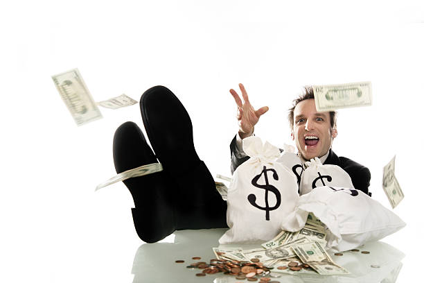 Businessman surrounded by money. http://www.lisegagne.com/images/business.jpg