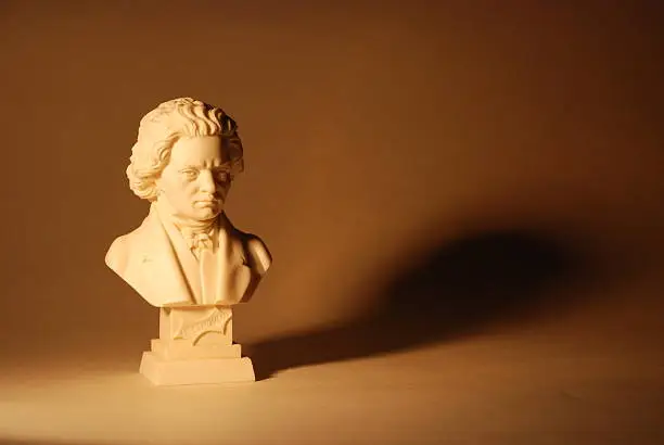 A dramatically lit bust of classical composer Beethoven. Great copy space on the right.