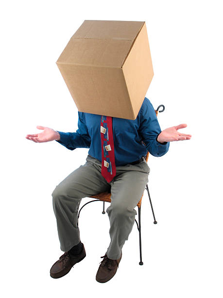 istock Thinking Inside the Box: Businessman Showing Uncertainty 172230433