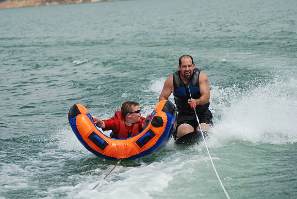 istock Kneeboarding and Tubing Together 172230640