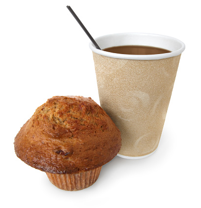 Breakfast or snack to go : a muffin and coffee in a disposable cup.