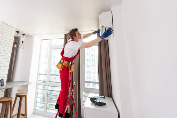 istock Professional technician maintaining modern air conditioner indoors. 1722312019