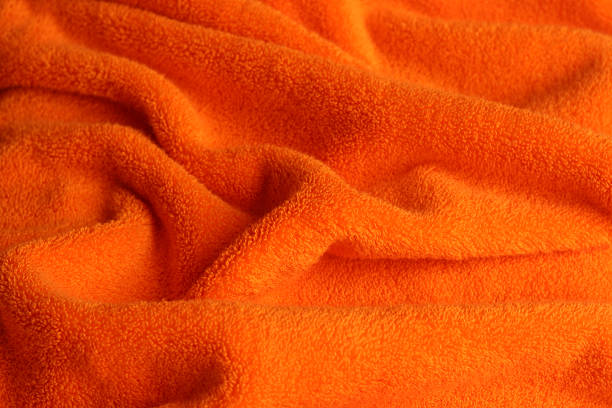 Orange towel background Orange towel background for websites and other designsand for more beautiful backgrounds please click terry towel stock pictures, royalty-free photos & images