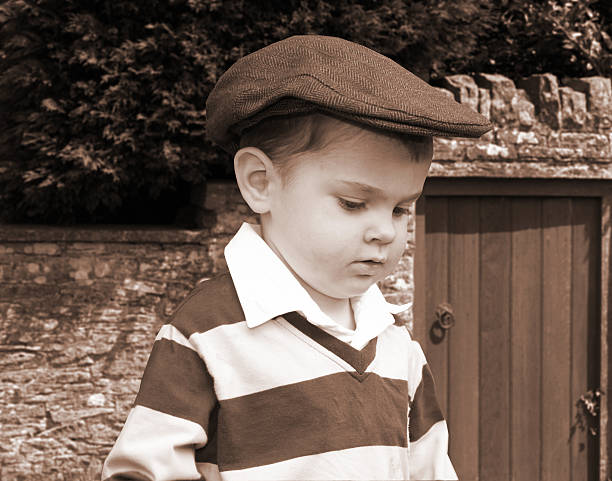 istock Toddler in flat cap sepia 172232169