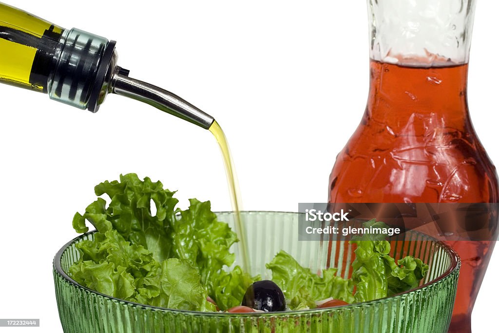 Versare l'olio per insalata - Foto stock royalty-free di Aceto