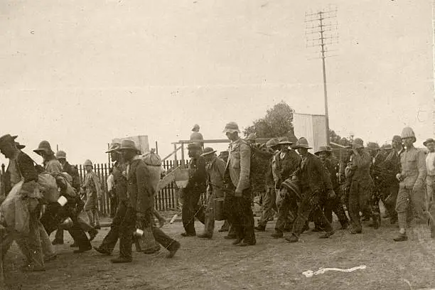 "Boer prisoners of war guarded by British soldiers.   Boer War, South Africa."