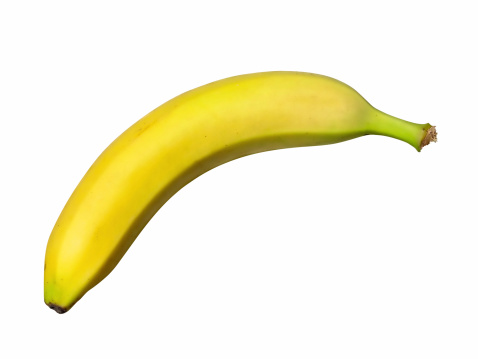 Ripe yellow bananas and cuts of peeled banana on white background. File contains clipping path.