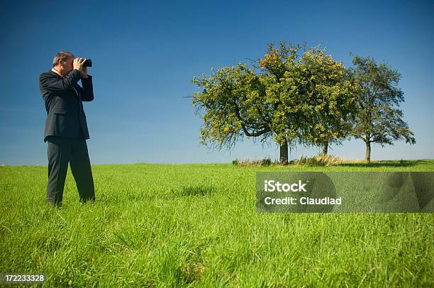 Business Man In A Field Stock Photo - Download Image Now - Binoculars, Looking, Men