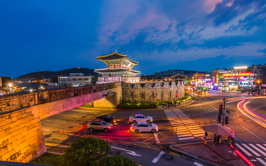 Suwon, South Korea: July 30, 2023: Hwaseong Fortress's Janganmun Gate at dusk. This famous historical site is a UNESCO World Heritage Site, It was almost the former capital of Korea.