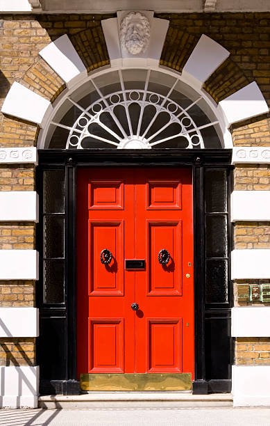 istock Red door on London home framed in black 172236142