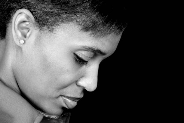 thoughtful woman a woman deep in thought in black and white racism photos stock pictures, royalty-free photos & images