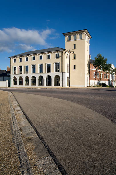 Poundbury One of the many traditionally-inspired buildings in Poundbury - Prince Charles’ urban extension to Dorchester, the County town of Dorset dorchester on thames stock pictures, royalty-free photos & images