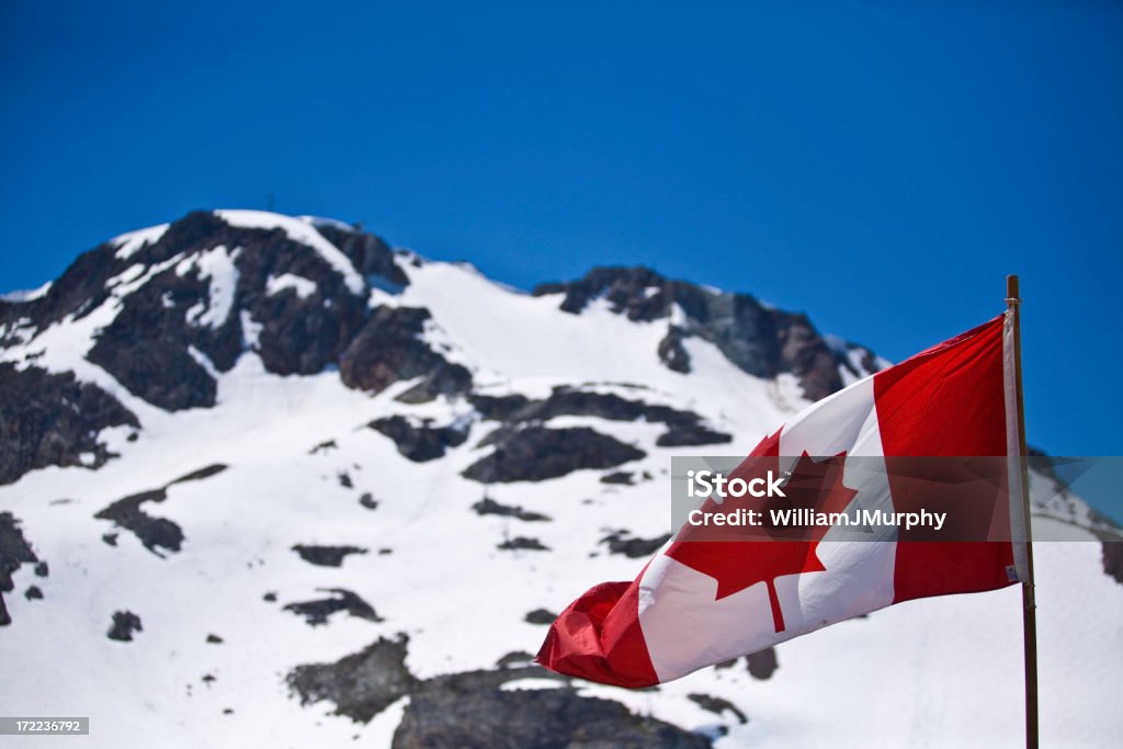Canadian Rockies (flag, patriotism, canada) The Canadian flag flutters over the Rockies Backgrounds Stock Photo
