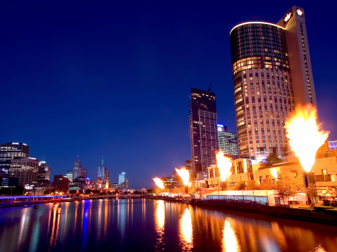 The Crown Casino fireshow, with the Melbourne skyline reflected off the Yarra river