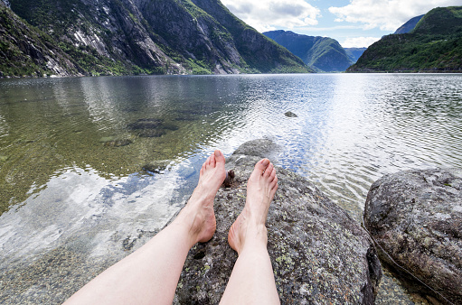 relaxing at Eidfjordvatnet, moraine-dammed lake in the municipality of Eidfjord in Hordaland county, Norway