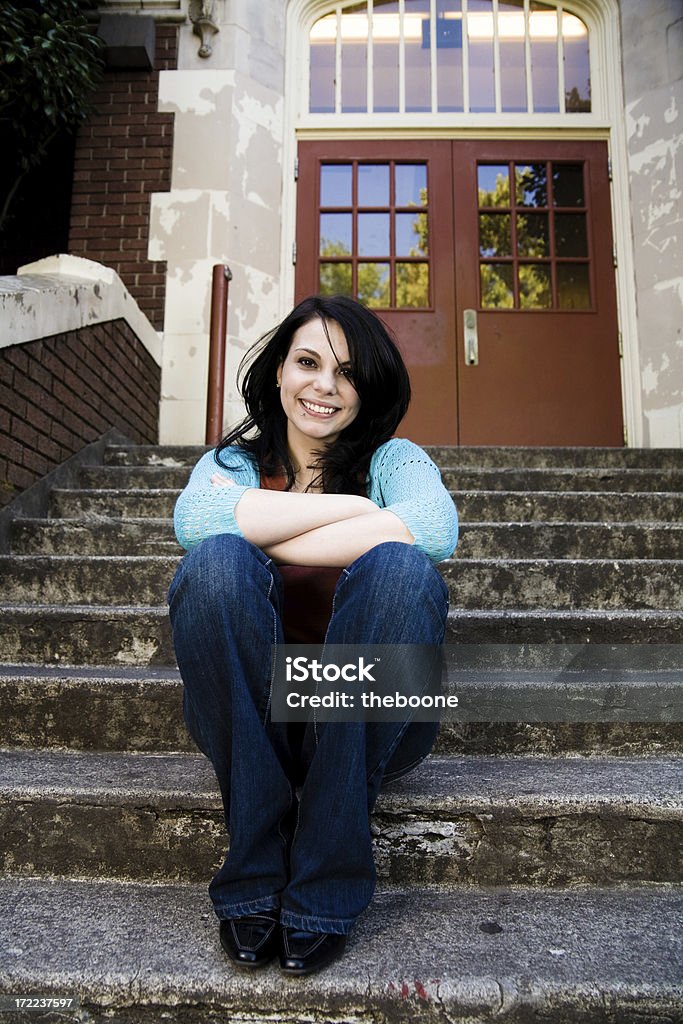 young student on school stairs cute young student sitting on school stairs 18-19 Years Stock Photo