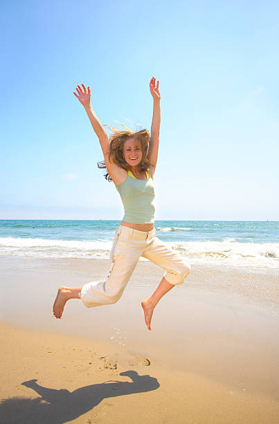 istock Girl Jumping on Santa Monica Beach 172238108