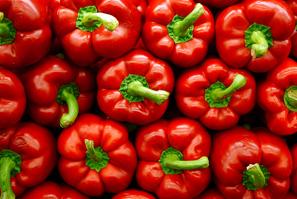 Red Peppers Vibrant stack of red peppers. bell pepper stock pictures, royalty-free photos & images