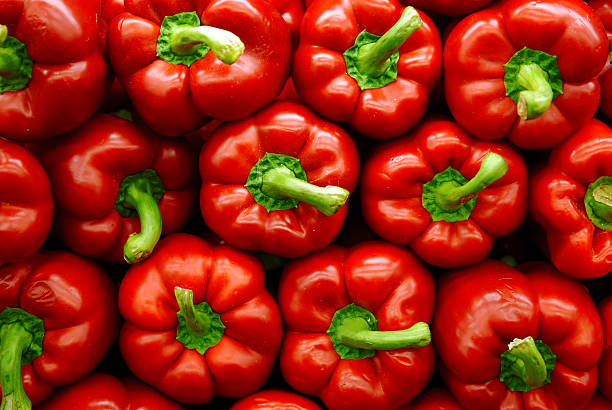 Red Peppers Vibrant stack of red peppers. red bell pepper stock pictures, royalty-free photos & images