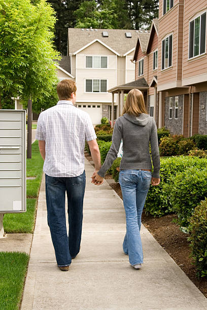 istock couple walking down the sidewalk, cute, attractive, 172238299