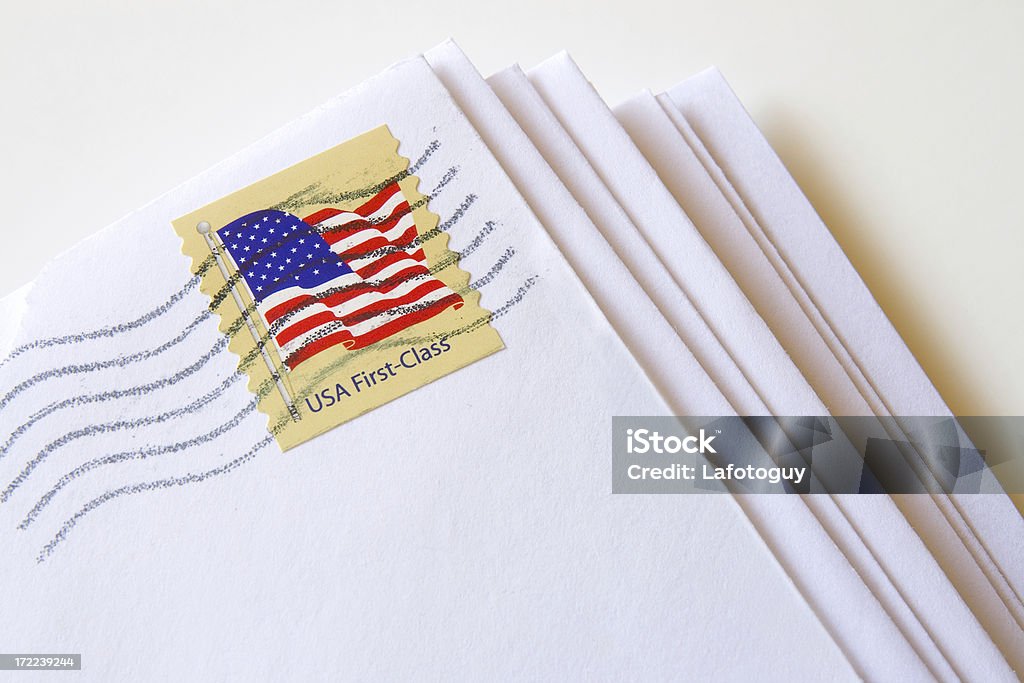 USA First Class Mail Stack of letters with USA First Class Stamp United States Postal Service Stock Photo