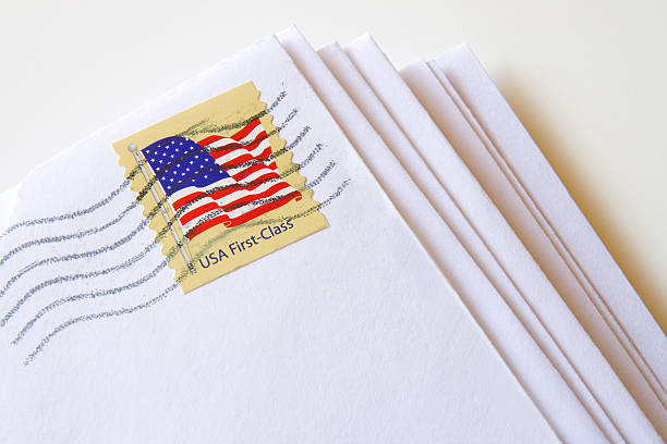 USA First Class Mail Stack of letters with USA First Class Stamp Usps stock pictures, royalty-free photos & images