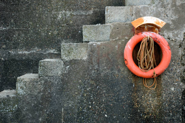 Orange Life Belt on a Marina Wall