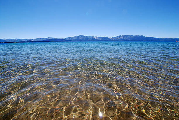 Lake Tahoe sun reflection on water stock photo
