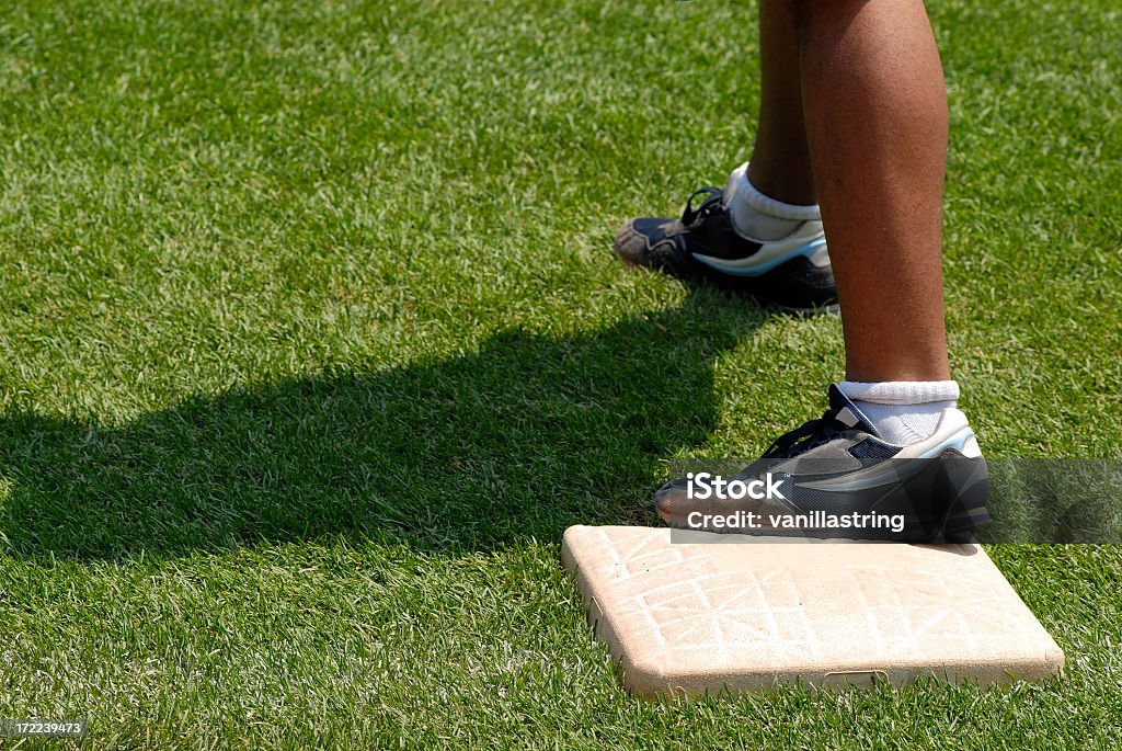 Uomo sulla base - Foto stock royalty-free di Campo da baseball