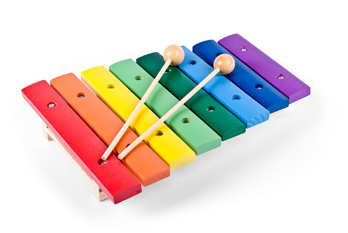 Rainbow colored toy xylophone with wooden mallets