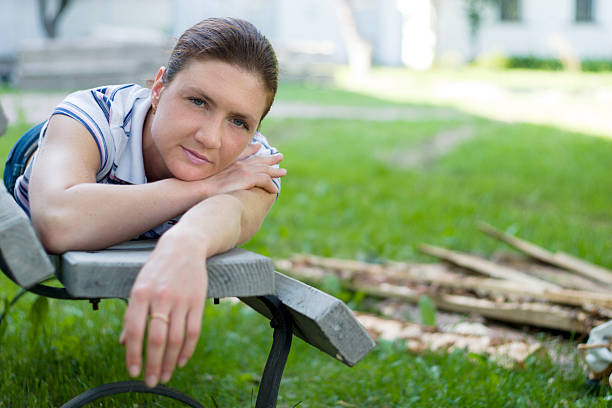 Beautiful girl resting on the bench stock photo