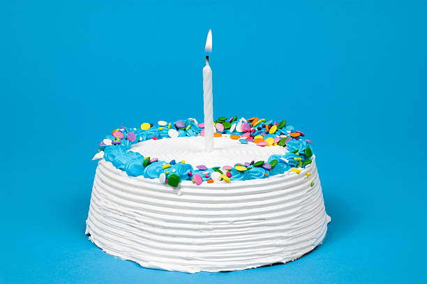 istock A white and blue birthday cake with one candle 172240117