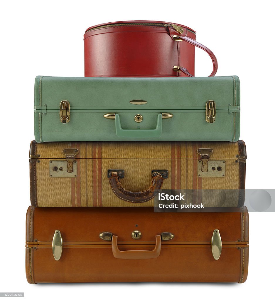 Travel Cases Four vintage travel cases on white. Old-fashioned Stock Photo