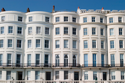A Regency residential terrace in Brighton, UK, looking out to sea.