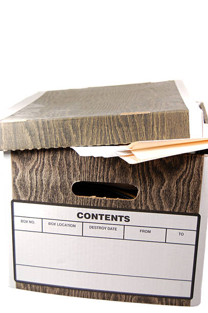 Close-up of a file box with folders and documents inside stock photo