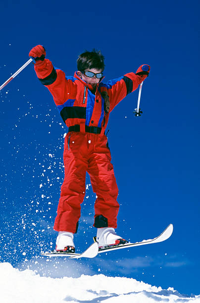 istock Boy Jumping on Snow Skis 172241892