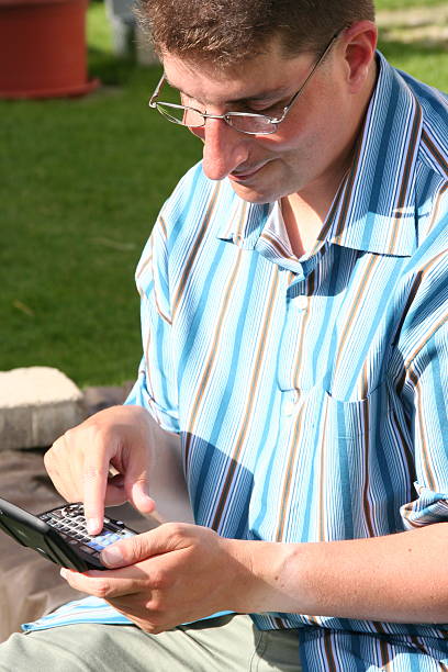 człowiek z kieszeni komputera - treo zdjęcia i obrazy z banku zdjęć